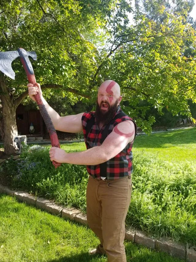 man carrying axe